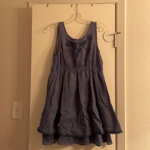 Blue sleeveless dress with floral details on top